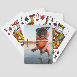 Baralho Pug Playing Ball on Beach