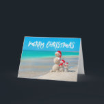 Beach Tropical Snowman Sand Feliz Cartão de Natal<br><div class="desc">Bola de Neve Tropical de Praia. Faça-o por conta própria clicando no botão "Personalizar" e adicionando uma mensagem personalizada. Dê uma na moda para nossos selos postais de feriados.</div>