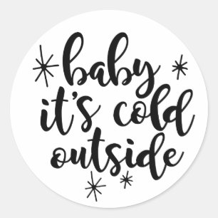 Bebê é etiqueta exterior fria do Natal