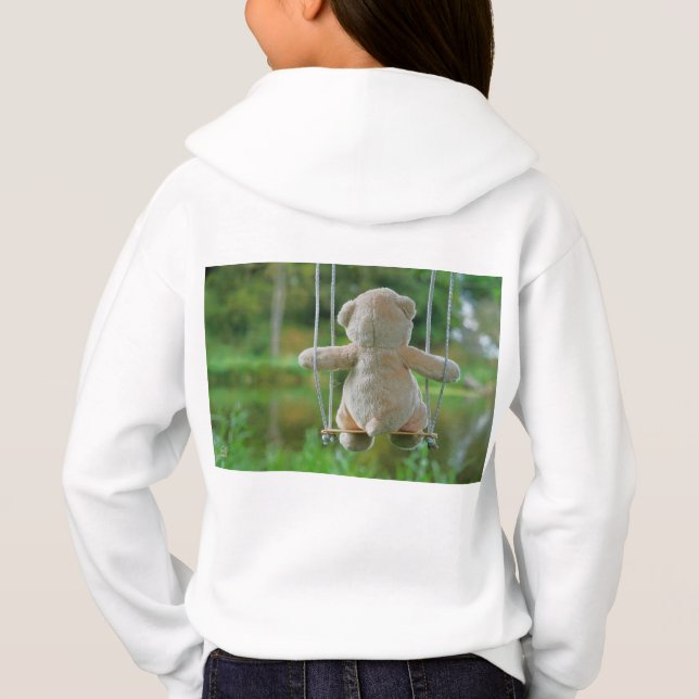 Beer op schommel vanaf de rug. (Verso)