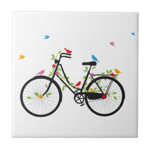 Bicicleta velha com flores e aves