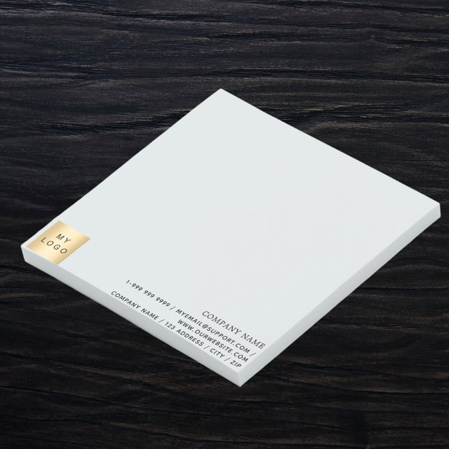 Bloco De Notas Cinzas leves do logotipo comercial (Criador carregado)