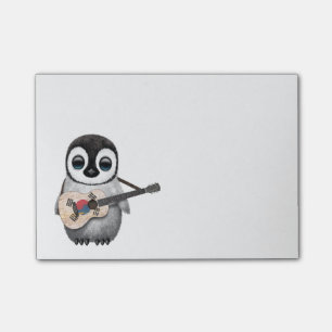 Bloco De Notas Pinguim que joga a guitarra coreana sul da