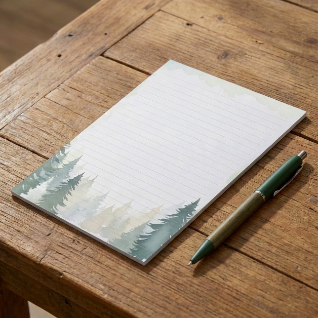 Bloco de notas revestido por pinheiro verde de inv (Winter themed green pine trees lined notepad.)