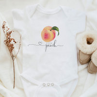Pequena roupa para bebê de pêssego