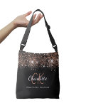 Bolsa Ajustável Script rosa de monograma preto<br><div class="desc">Um fundo preto chic decorado com faíscas de ouro rosa. Personalize e adicione seu primeiro nome,  iniciais do monograma e nome do cheio. Texto branco e rosa dourado. O primeiro nome é escrito com um moderno estilo escrito à mão.</div>