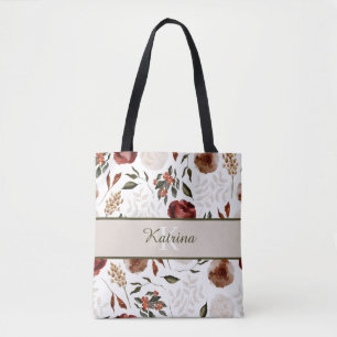 Bolsa de mão com flores monogramadas