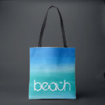 Bolsa Tote Água de Praia Aquarela Oceano Azul Verde<br><div class="desc">Este design de praia apresenta texto desgastado em um fundo azul e verde oceano em aquarela. Clique no botão personalizar para opções de modificação ou adição de texto! Variações deste design, cores adicionais, bem como produtos coordenados estão disponíveis em nossa loja, zazzle.com/store/doodlelulu. Entre em contato conosco se você precisar deste...</div>