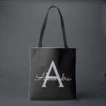 Bolsa Tote Black Silver Modern Script Girly Monographic Name<br><div class="desc">Black and Silver Elegant adicione seu próprio nome Monograma Book Bag. Este Livro Bag pode ser personalizado para incluir seu nome inicial e próprio e ser dado como presente para o Natal,  Doce 16 Aniversário,  Chá de panela ou Casamento.</div>