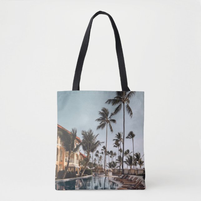 Bolsa Tote Brown wooden lounge chairs near pool surrounded by (Frente)