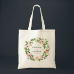 Bolsa Tote Casamento floral cor-de-rosa<br><div class="desc">Saco de tote de casamento floral cor-de-rosa esbranquiçada. Design floral elegante de aquarela floral e belas caligrafias de guiões. Os tons suaves adicionam uma elegância calma a esta suíte de casamento. edite o texto para mostrar os nomes da noiva e noiva ou da mãe da noiva, dama de honra, florista...</div>