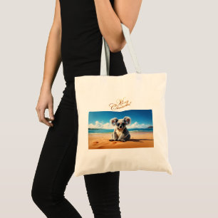 Bolsa Tote Coala numa praia arenosa Feliz Natal
