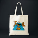 Bolsa Tote Cookie Monster Eating All the Cookies<br><div class="desc">Satisfy your cravings for fun and cookies with this graphic featuring the one and only Cookie Monster! This showcases a vibrant illustration of Cookie Monster in his element, happily devouring a pile of chocolate chip cookies with crumbs flying everywhere. This classic and instantly recognizable design is cheerful, playful, and sure...</div>
