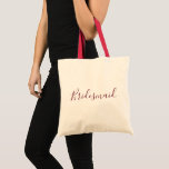 Bolsa Tote Fonte Bridesmaid Burgundy<br><div class="desc">Uma bela sacola de tote para uma bela dama de pontas, esta design apresenta "Bridesmaid" escrita com uma adorável letra cursiva de burgundy. Faça seu pedido hoje mesmo!</div>