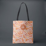 Bolsa Tote Groovy Monograma Floral Laranja Retrô<br><div class="desc">A Bolsa Groovy Retro Laranja com Florais e Monograma é um acessório elegante e funcional perfeito para qualquer ocasião. Com seu padrão floral laranja ousado e monograma personalizado, essa bolsa adiciona um toque vibrante de cor ao seu guarda-roupa. Espaçosa o suficiente para carregar todos os seus pertences essenciais, seja indo...</div>
