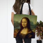 Bolsa Tote Mona Lisa | Leonardo da Vinci<br><div class="desc">Mona Lisa (1503-1506) apresentada pelo artista Renascentista italiano Leonardo da Vinci. O trabalho original é óleo no painel de madeira poplar. Pensa-se que esta famosa pintura seja um retrato de Lisa Gherardini, e foi aclamada como "a mais conhecida, a mais visitada, a mais escrita, a mais cantada, a mais parodiada...</div>