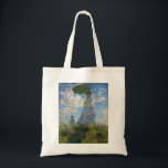 Bolsa Tote Monet The Promenade Woman com Parasol<br><div class="desc">Claude Monet A Promenade Mulher com Parasol. Pintura a óleo na canvas de 1875. Um dos mais charmosos trabalhos iniciais de Monet, The Promenade apresenta uma jovem mulher e uma criança em um campo acima das flores silvestres amarelas. A mulher segura um parasol verde e azul enquanto o vento puxa...</div>