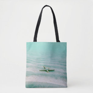 Bolsa Tote Starfish branco sobre areia submarina pela manhã