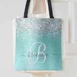 Bolsa Tote Teal Brugado Metal Silver Glitter Nome Monograma<br><div class="desc">Personalize facilmente este design de saco de tota chic com tendência que apresenta brilho prateado bonito num fundo metálico escovado teal.</div>