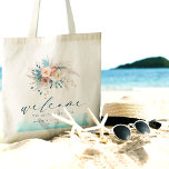 Bolsa Tote Tote Tote de Casamento de Destino de Praia<br><div class="desc">Faça uma declaração de na moda com este Tote Bag de Casamento de Destino de Praia, perfeito para a sua celebração costeira. Apresentando um design de sereno de aquarela em tons azuis, lacrimejantes, turquesas, e tons de pêssego, juntamente com delicados sotaques florais, ele oferece uma vibração chic e boho. Com...</div>