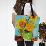 Bolsa Tote Três girassóis | Vincent Van Gogh<br><div class="desc">Três girassóis (1888) pelo artista holandês Vincent Van Gogh. A pintura de arte original é um óleo na canvas que representa uma vida estática de girassóis amarelos brilhantes contra um fundo de turquesa. Use as ferramentas de design para adicionar texto personalizado ou personalizar a imagem.</div>