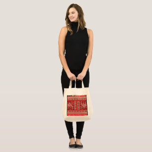 Bolsa Tote um design floral vermelho e verde num fundo preto