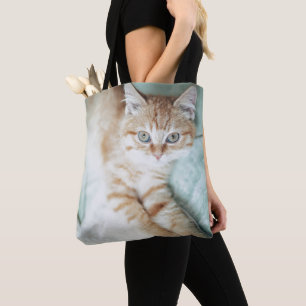 Bolsa Tote Um gatinho dourado da cor que encontra-se para