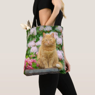 Bolsa Tote Um Gato Laranja num Jardim com Flores de Mola Rosa