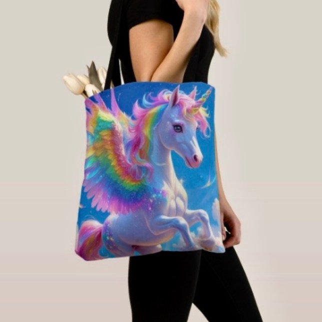 Bolsa Tote Unicórnio Saltitante com Asa de Arco-íris (Tote Bag — 100% polyester, black laminated lining 100% cotton web hand. Made in the USA.
)