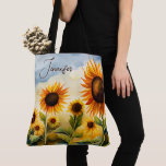 Bolsa Tote Whimsical Whimsical Sunflower Monograma<br><div class="desc">Este design apresenta um campo de aquarela cheio de lindos girassóis. Personalize-o com um nome. Faz um Dia de as mães de excelente ou presente de aniversário. Criado pela imprensa simplesmente de farmácia.</div>