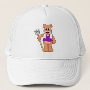 Boné Urso como agricultor com Rake