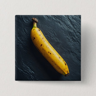 Bóton Quadrado 5.08cm Uma Banana em uma Superfície Escura