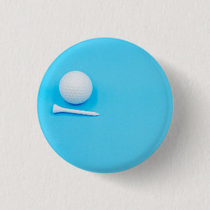 Bóton Redondo 2.54cm Bola de golfe e tetas estão sobre fundo azul