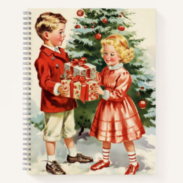 Boy and girl giving each other Christmas presents