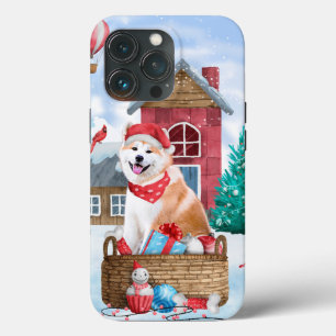 Cachorro Akita na Casa de Natal na Neve