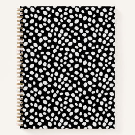 Caderno com padrão manchado preto e branco