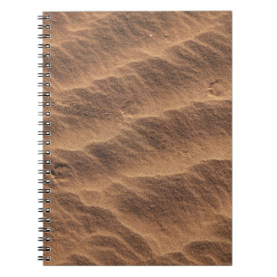 Caderno Espiral Areia castanha com água durante o dia