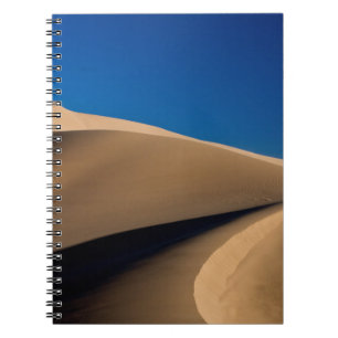 CADERNO ESPIRAL AREIA MARAVILHOSA SOB PELE AZUL DURANTE O DIA