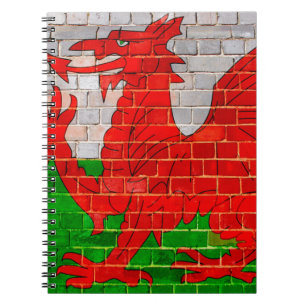 Caderno Espiral Bandeira do País de Gales numa parede de tijolos