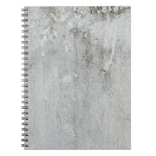 Caderno Espiral Cinza branca envelhecida na parede do alcatrão