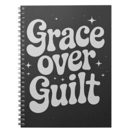 Caderno Espiral Grace sobre o notebook Guilt