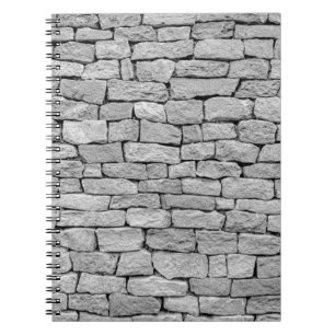 Caderno Espiral Gray stone wall as an abstract background.