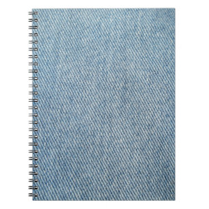 Caderno Espiral Lave com ácido jeans azuis, textura denim.