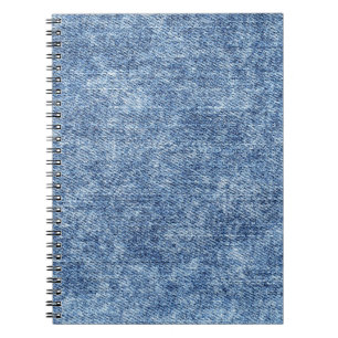 Caderno Espiral Lave com ácido o denim azul, textura próxima.