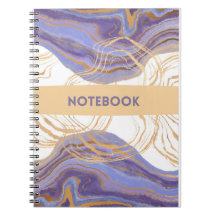 notebook roxo, dourado e branco