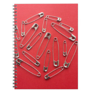 Caderno Espiral Pinos de segurança