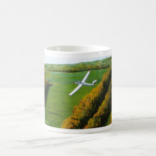 Café Caneca com "vôo de solo sobre a montanha azul "