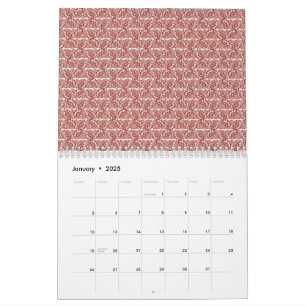 Calendário Têxteis vermelhos e cor-de-rosa deitados sobre um 