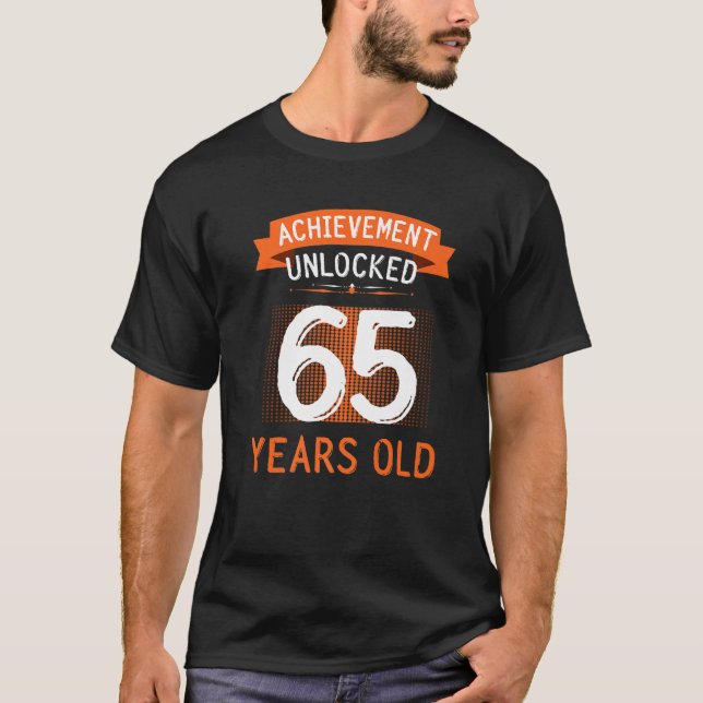 Camiseta 65.º Acervo De Aniversário Desbloqueado 65 Anos (Frente)