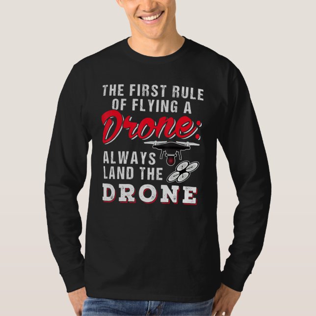Camiseta A Primeira Regra De Voar Um Drone Sempre Descarreg (Frente)